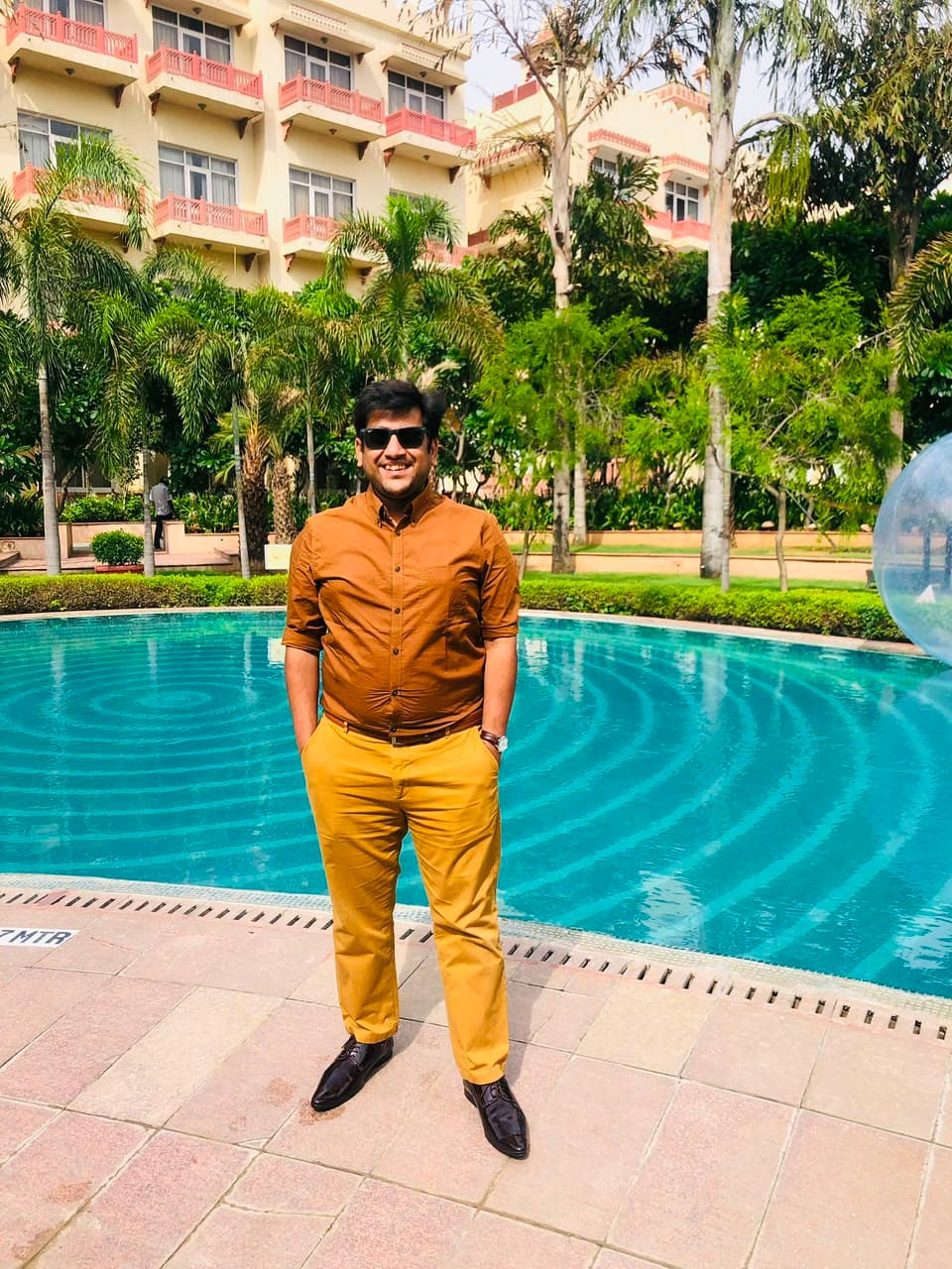 Mohit Garg standing beside a pool